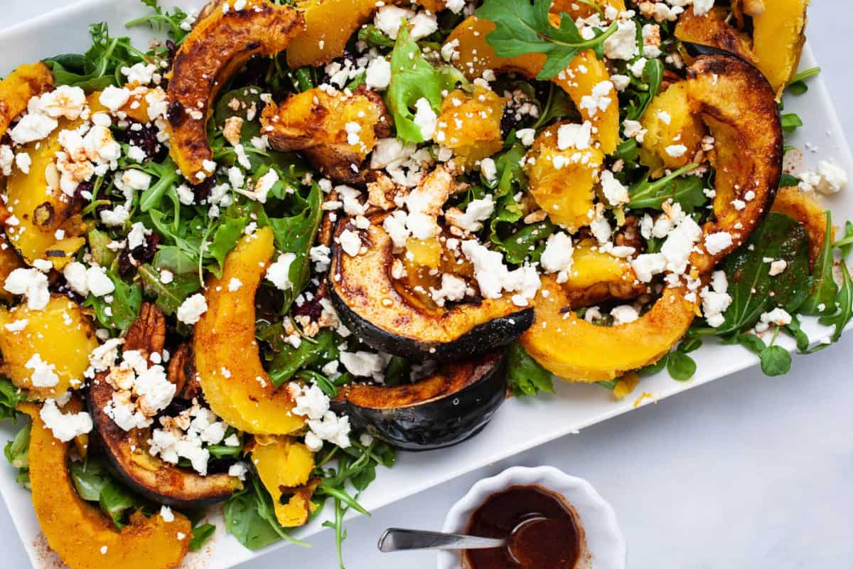 A plate of roasted acorn squash salad.