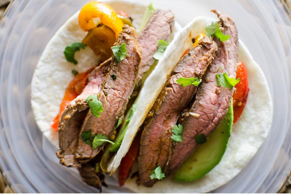 A plate of sheet pan beef fajitas.