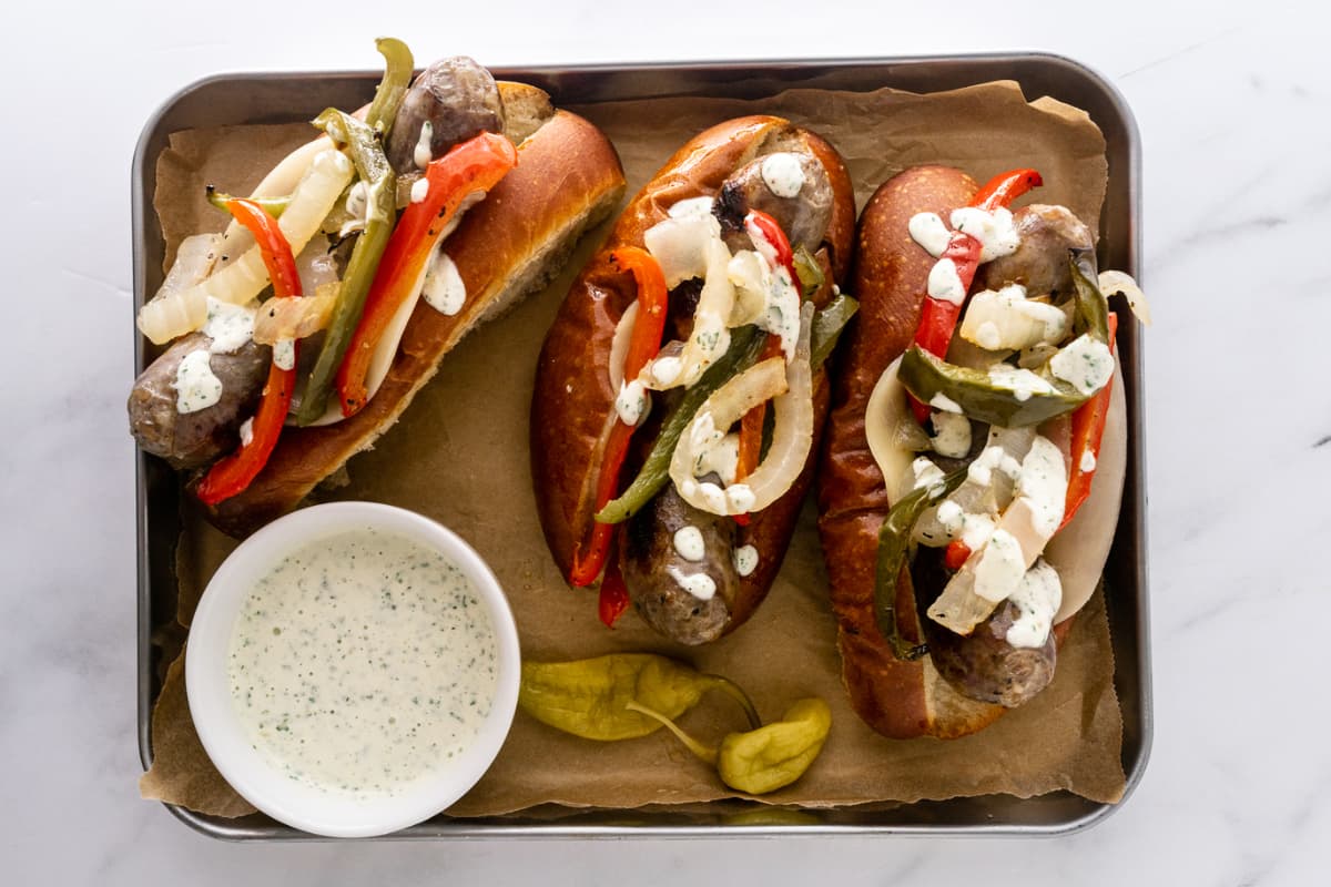 A sheet pan of sausage and peppers.