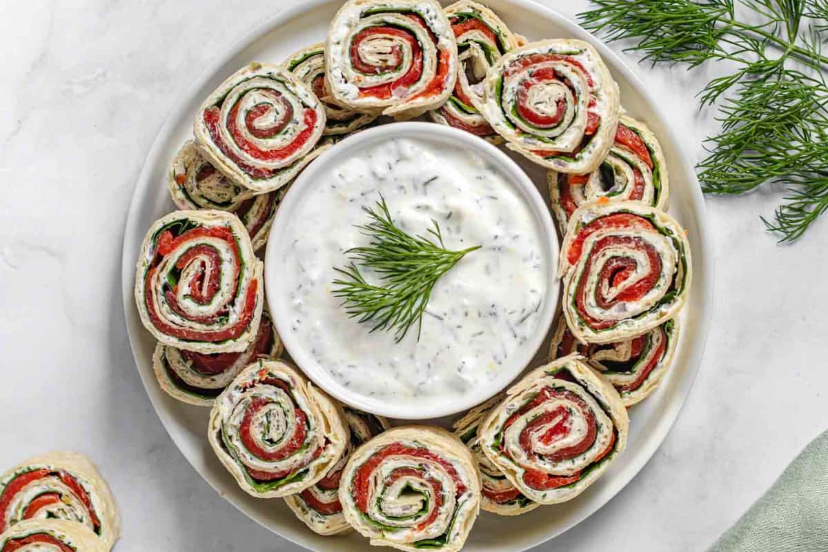 A plate of smoked salmon pinwheels.