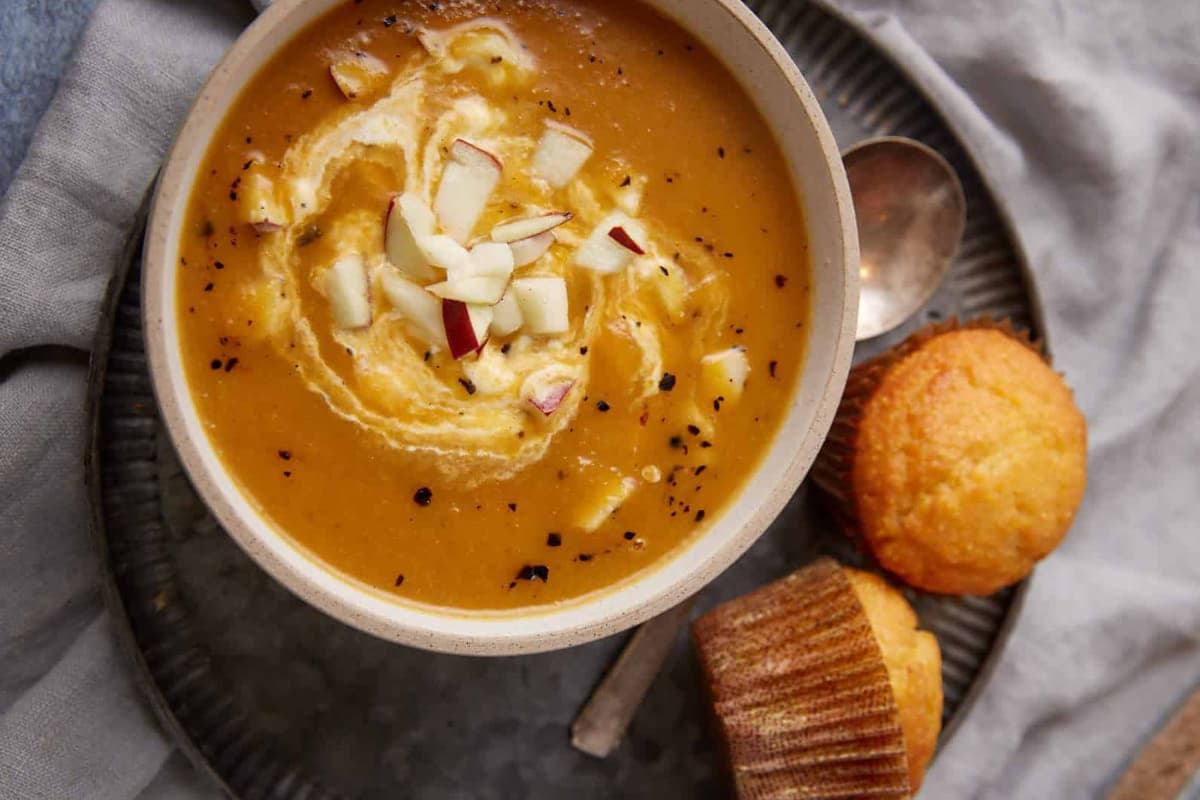 A bowl of butternut and apple soup.