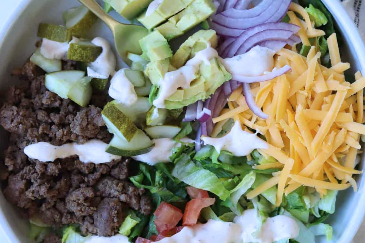 Overhead image of cheeseburger in a bowl.