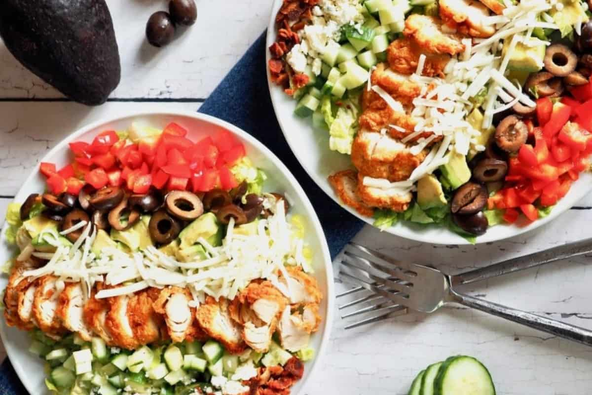 Plates of chicken cobb salad.