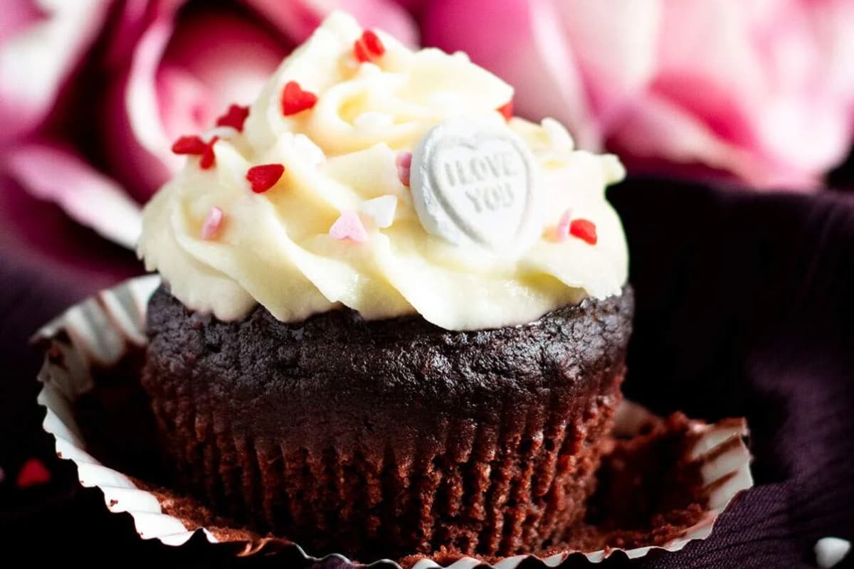 A chocolate and beetroot cupcake on a plate.