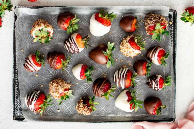 A tray of chocolate covered strawberries.