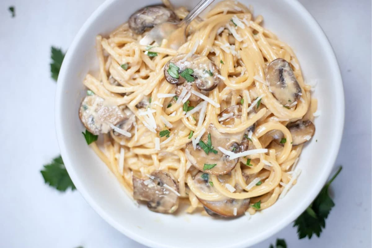 A bowl of creamy mushroom pasta.