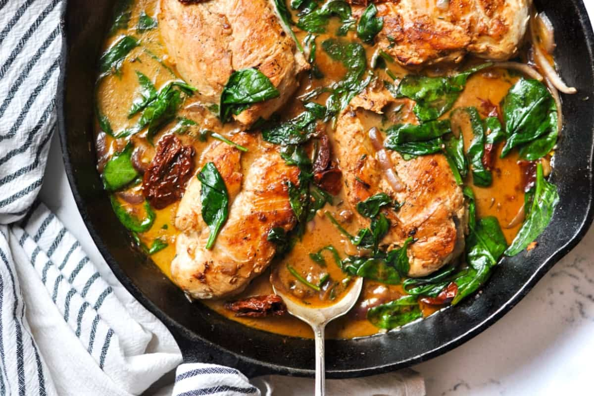 A skillet of creamy tuscan chicken.