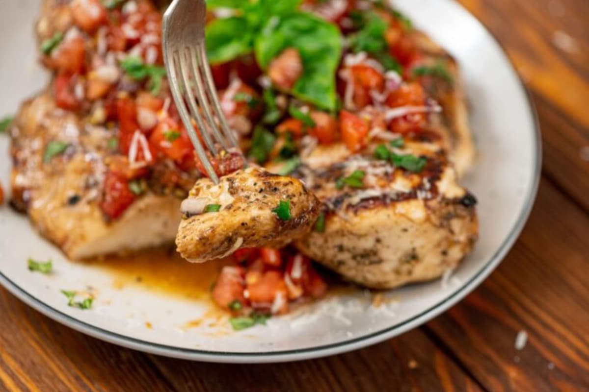 A plate of grilled bruschetta chicken.