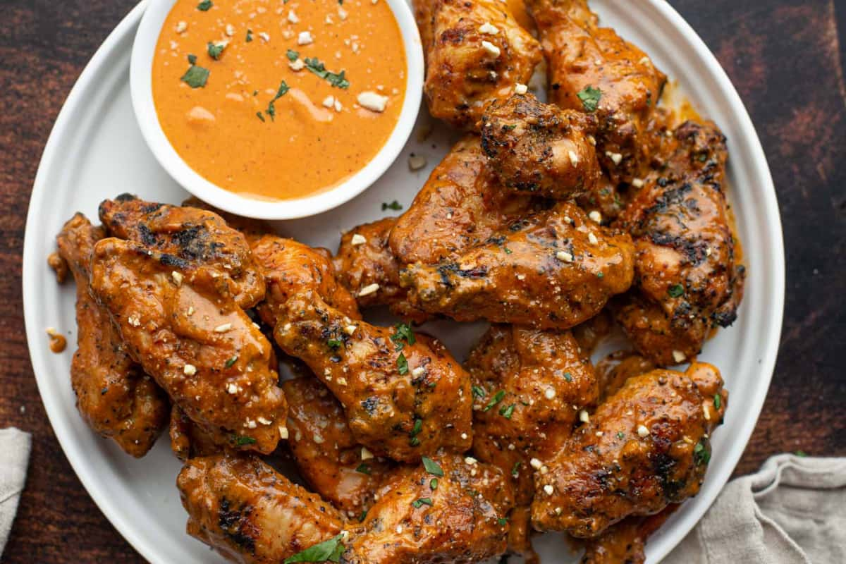 A plate of grilled chicken wings.