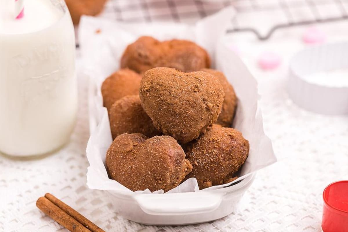 A dish of heart-shaped doughnuts.