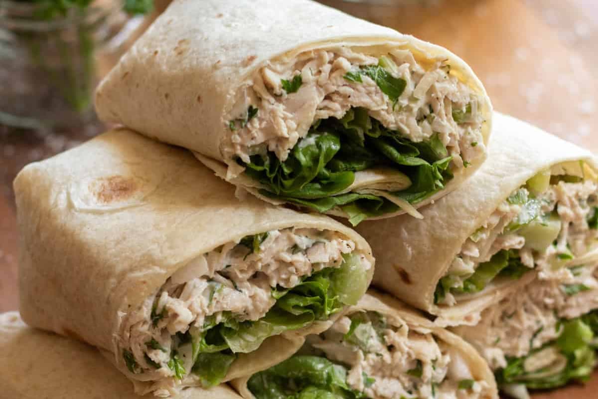 A plate of herbed chicken salad wraps.