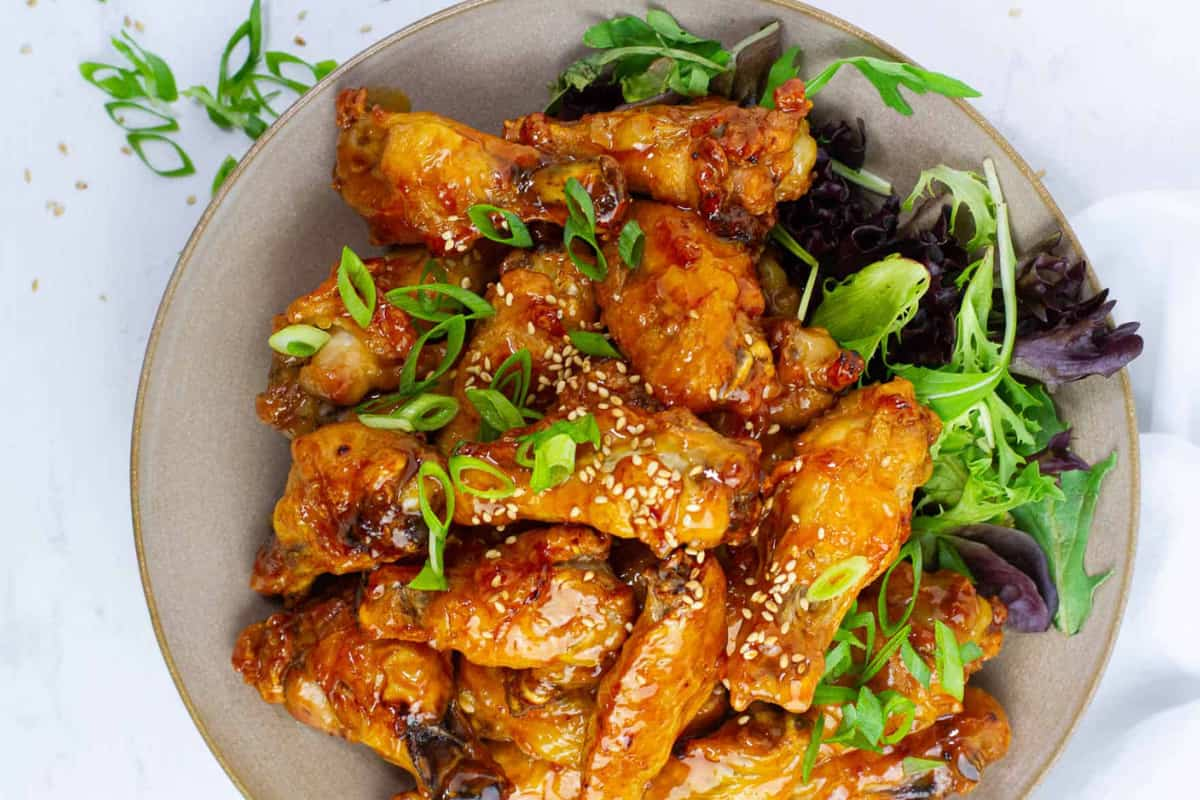 A plate of baked hot honey wings.