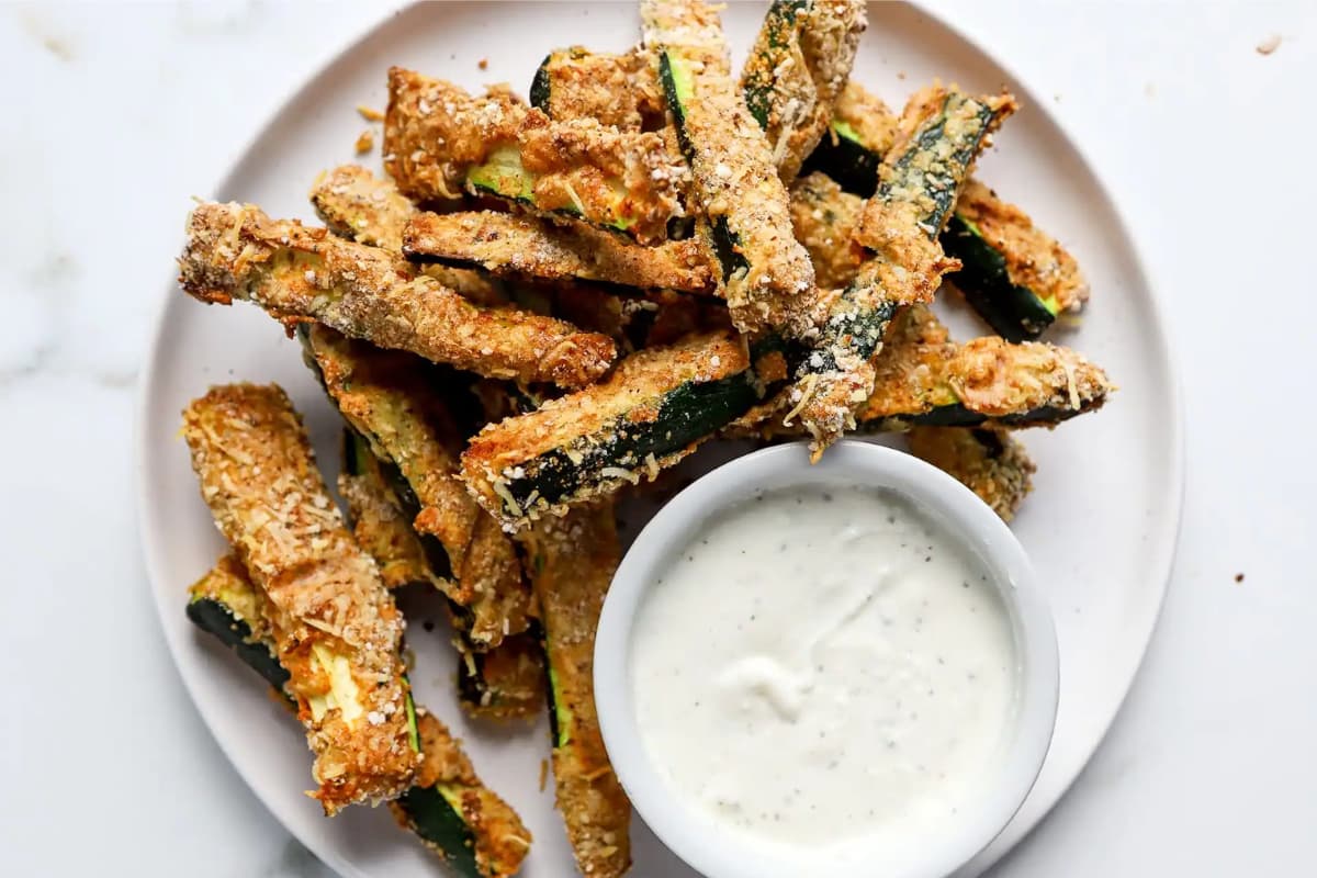 A plate of low carb air fryer zucchini fries.