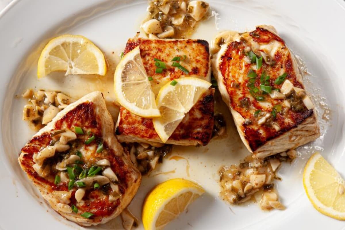 A plate of pan seared halibut.