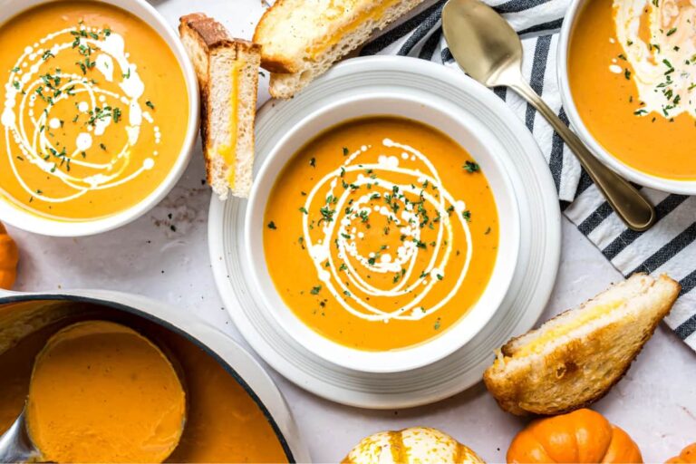 A bowl of pumpkin tomato soup.