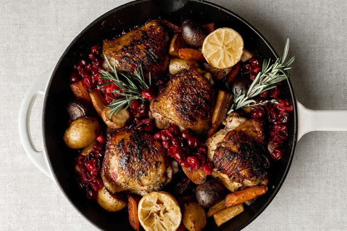 A skillet of roasted cranberry chicken.