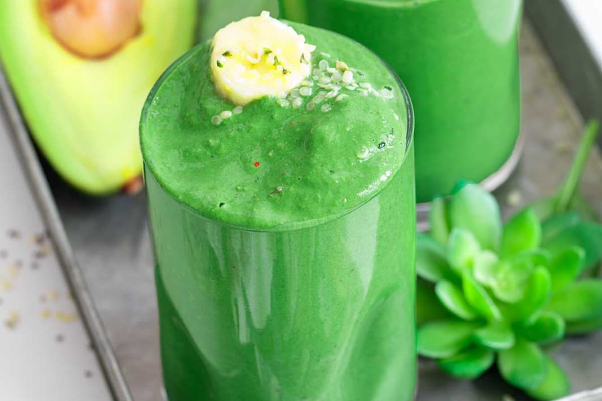 A glass of spinach avocado smoothie.