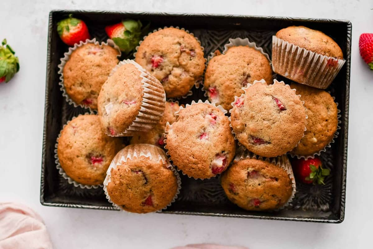 A tray of strawberry banana muffins.