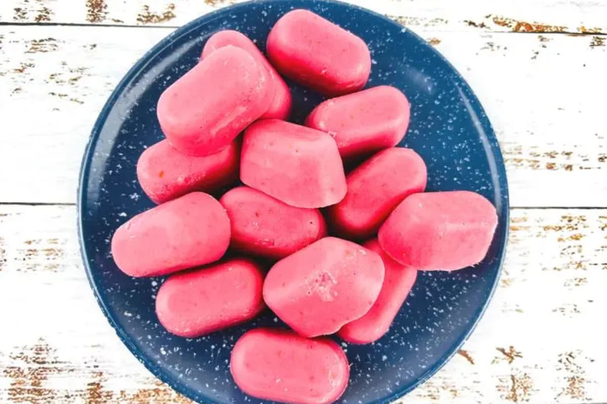 A plate of strawberry frozen yogurt bites.