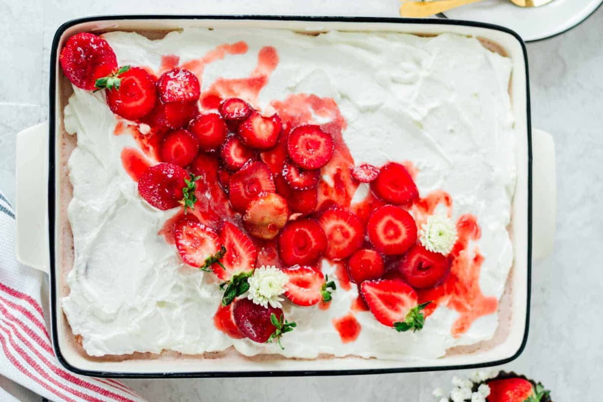 A dish of strawberry tres leches cake.