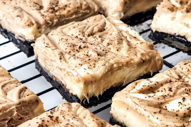 A tray of vanilla chocolate cheesecake bars.