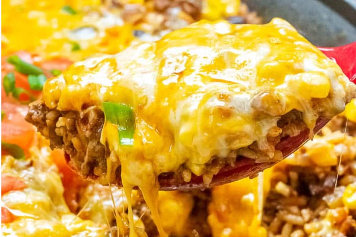 A spoonful of beef and rice skillet casserole.