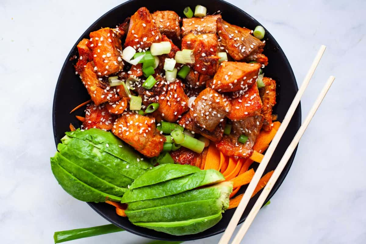 Overhead image of Cooked Salmon Poke Bowl With Easy Sauce.