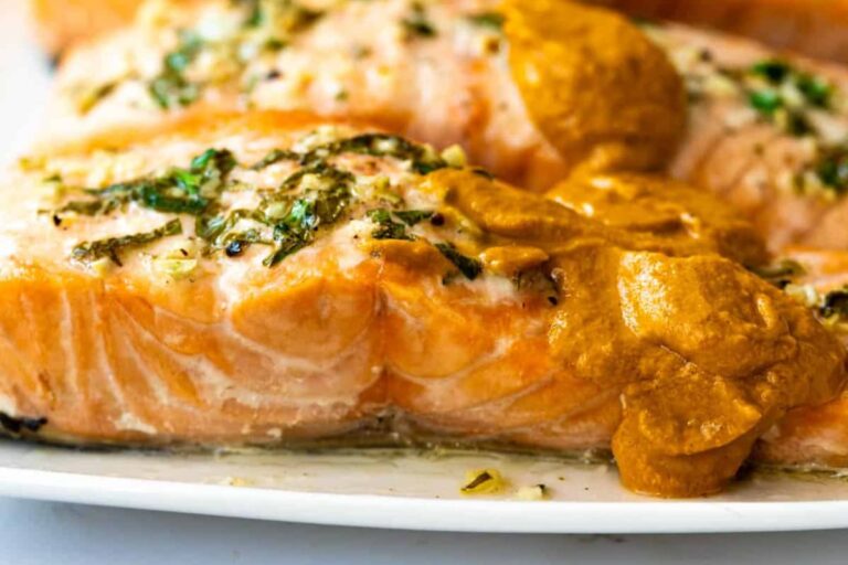 A plate of Baked Lemon Garlic Salmon Romesco.