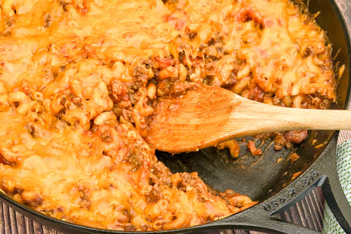 Overhead image of a skillet bacon cheeseburger casserole.