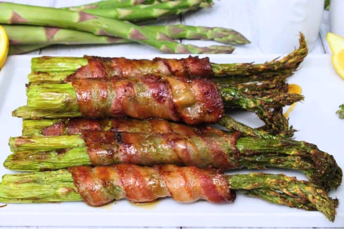 A plate of Air Fryer Bacon Wrapped Asparagus.
