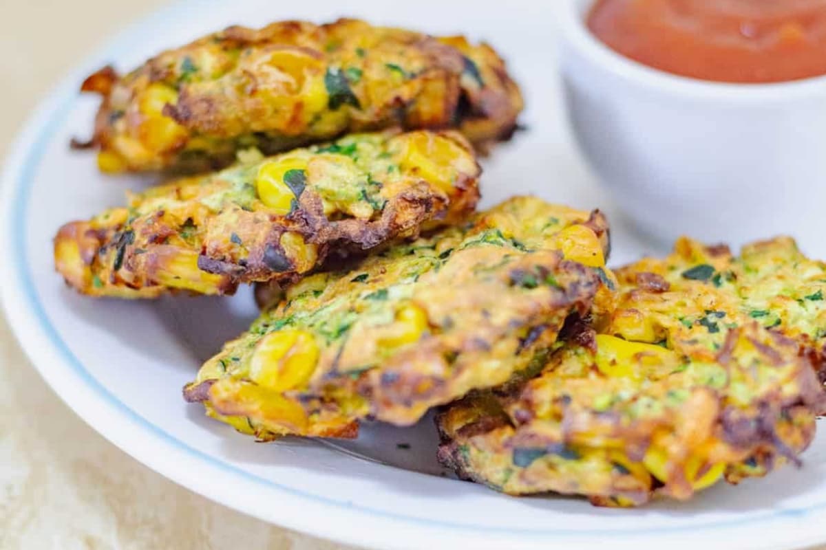 A plate Air Fryer Zucchini Corn Fritters.