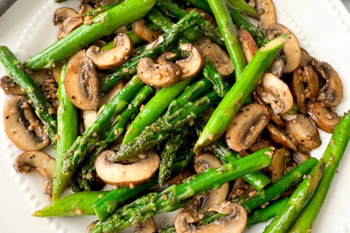 A plate of Sautéed Asparagus and Mushrooms.