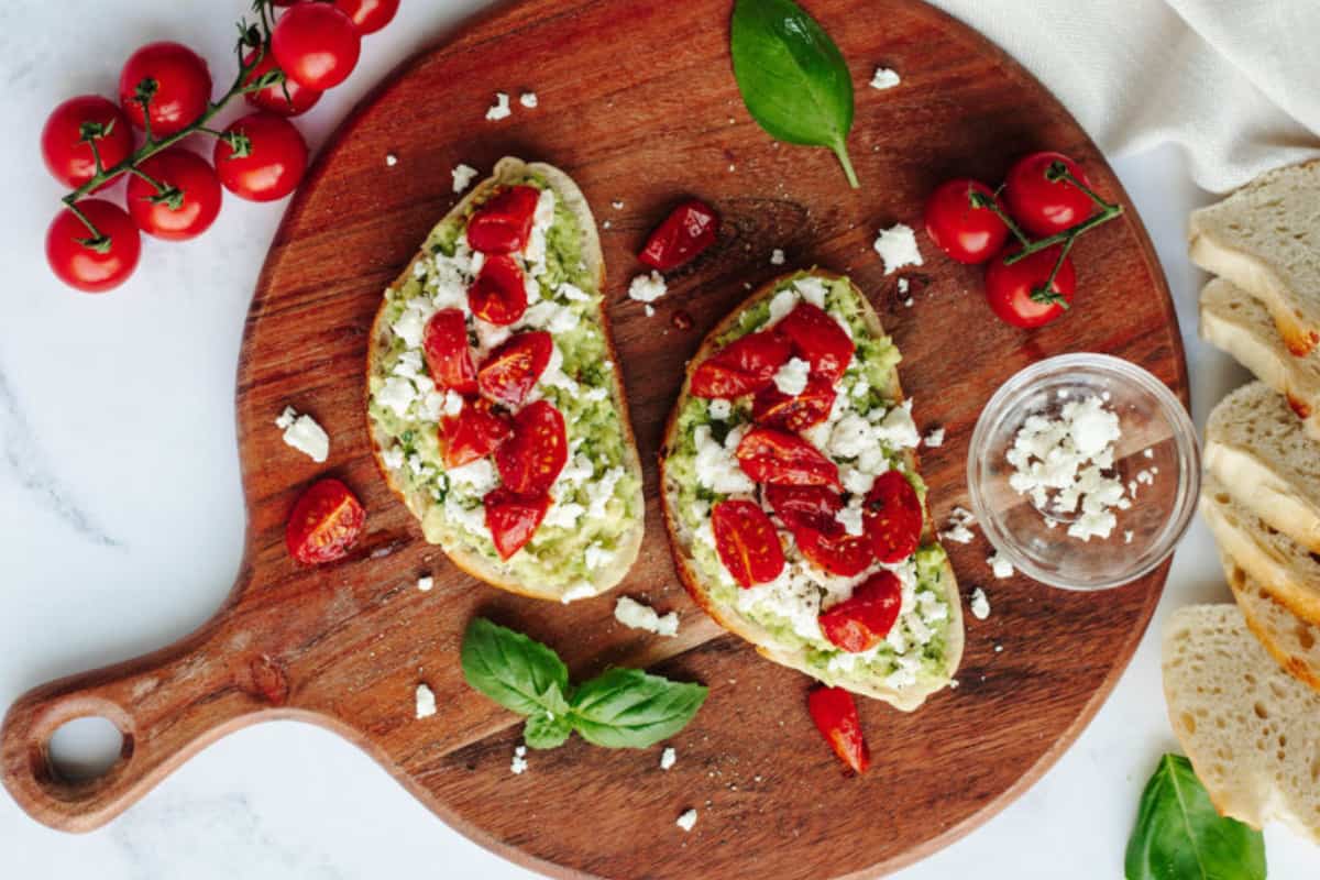 A plate of Avocado Toast with Tomato.
