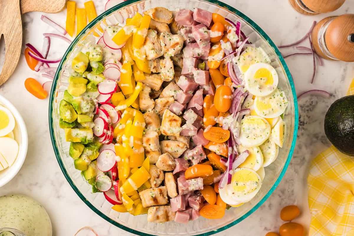 A bowl of Cobb Salad with ham.