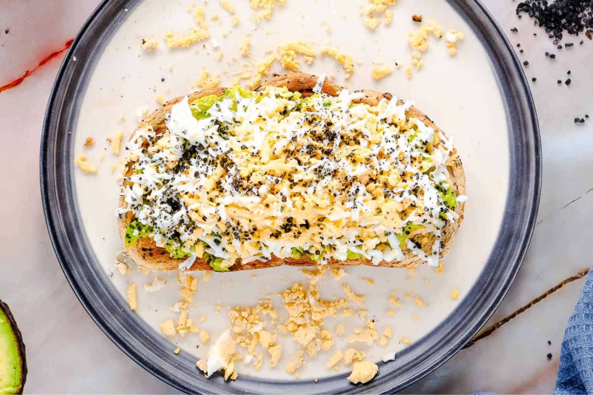 A plate of Grated Egg Avocado Toast.