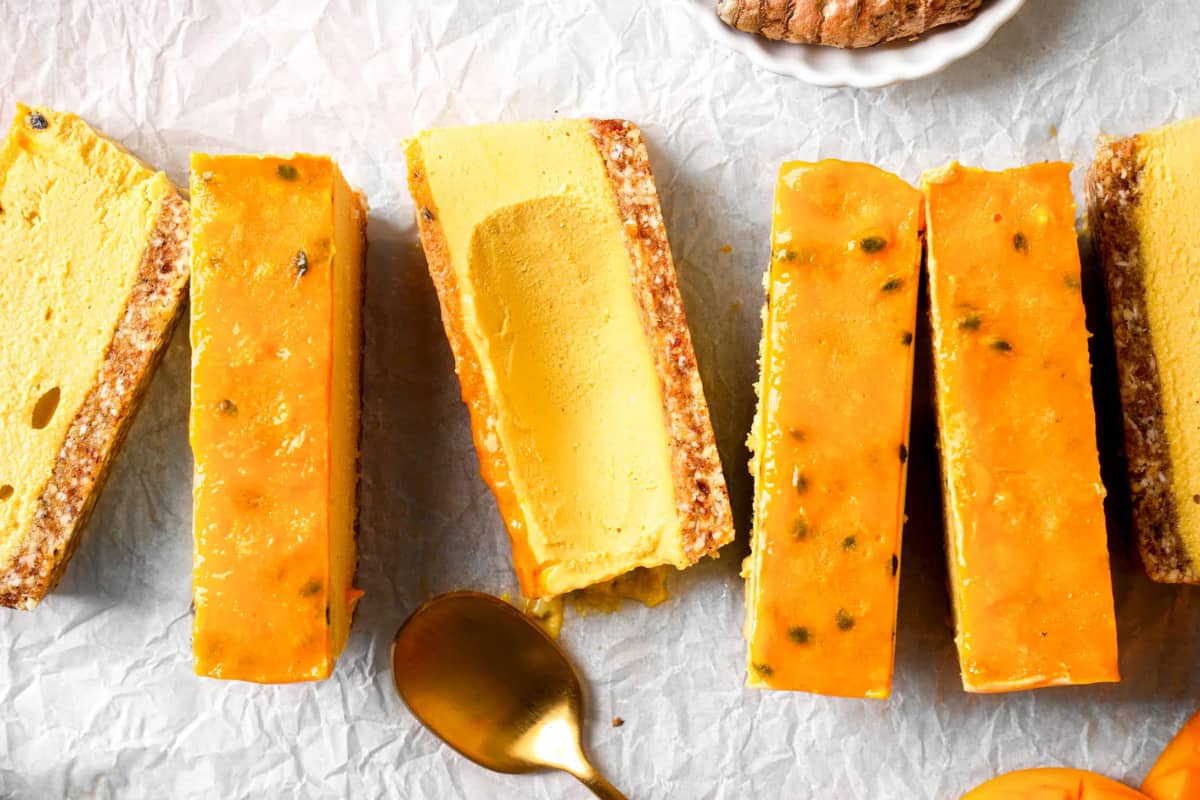 A plate of Passion Fruit Mango Cheesecake Bars.