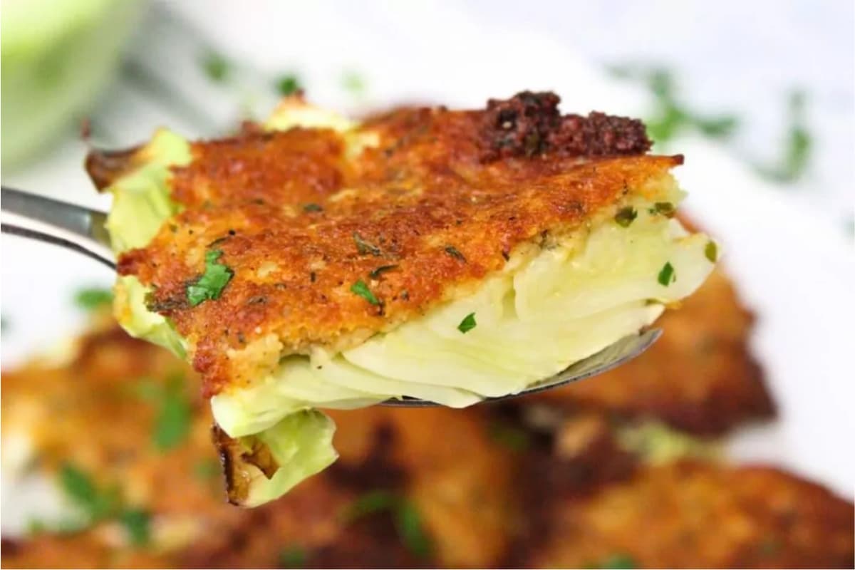 A spoon of Parmesan Crusted Cabbage.