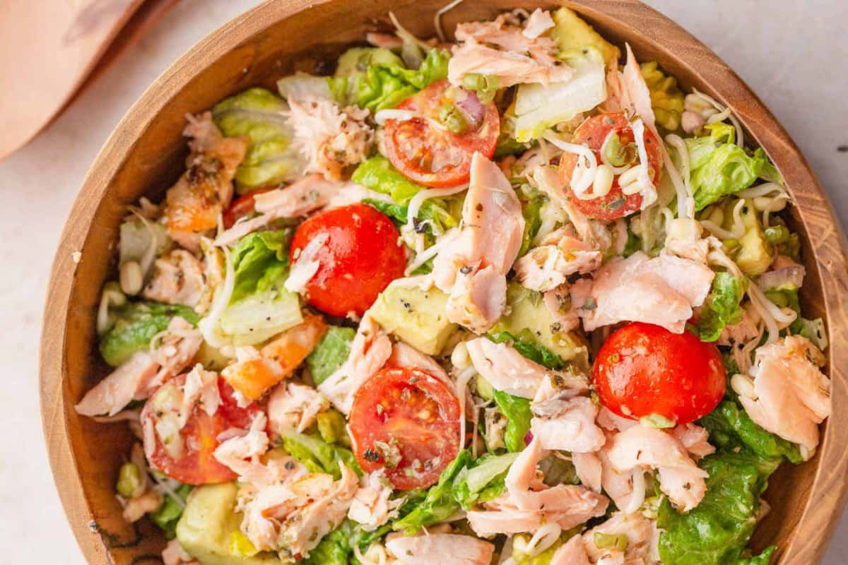 A bowl of Mediterranean Salmon Avocado Salad.