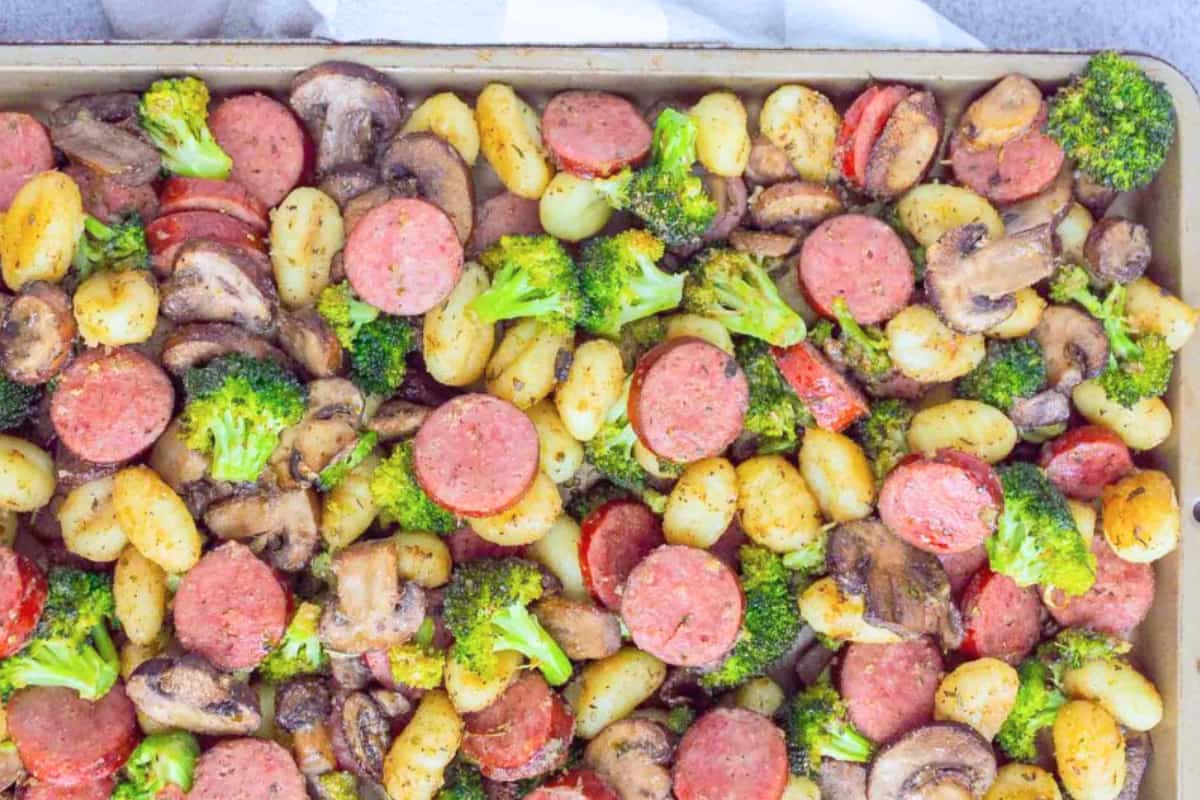 A dish of Sheet Pan Sausage and Gnocchi.