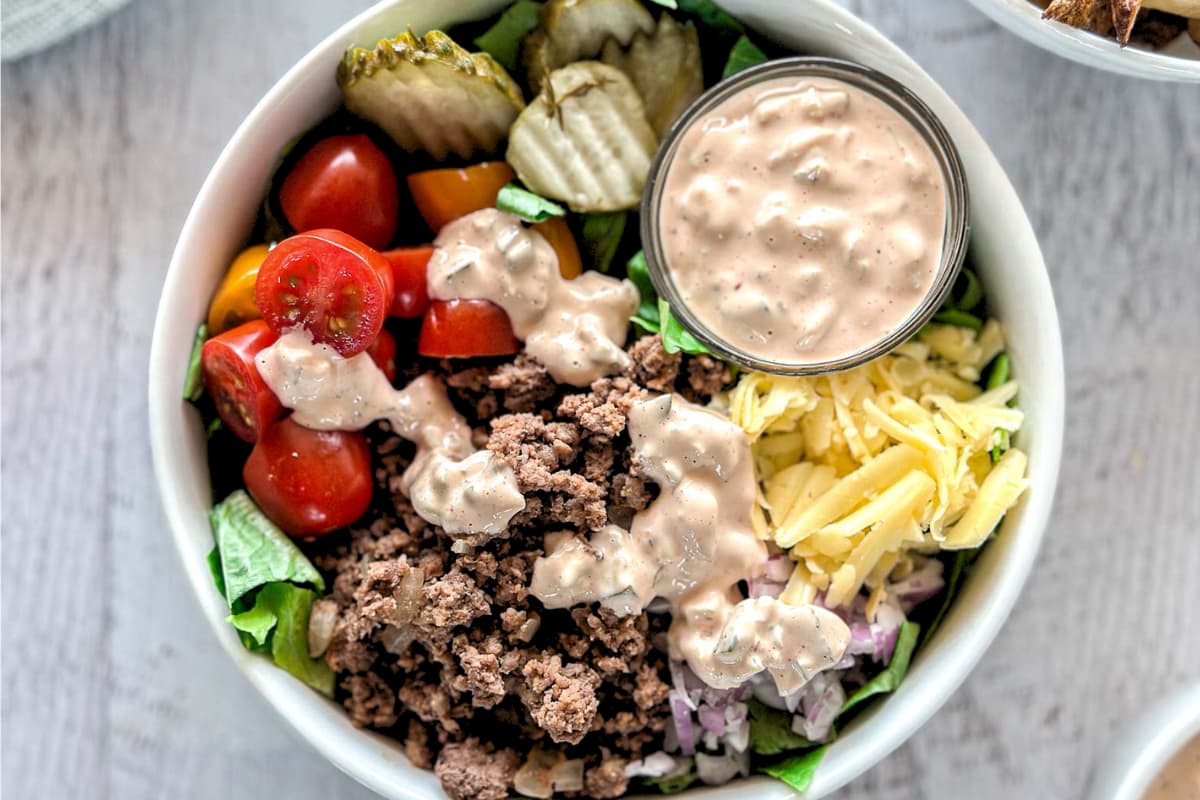 A bowl of Cheeseburger Bowl (With Smashburger Sauce).