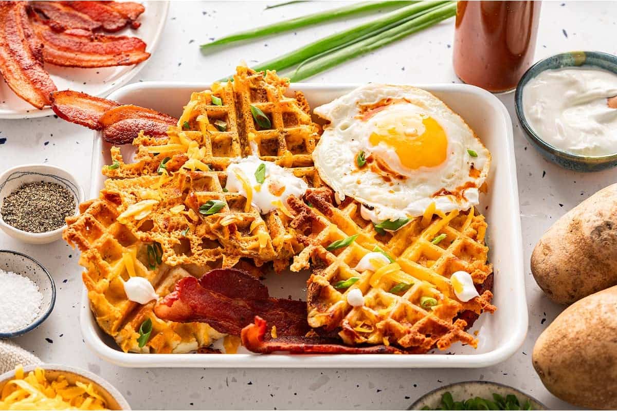 A plate of cheesy potato breakfast waffles.