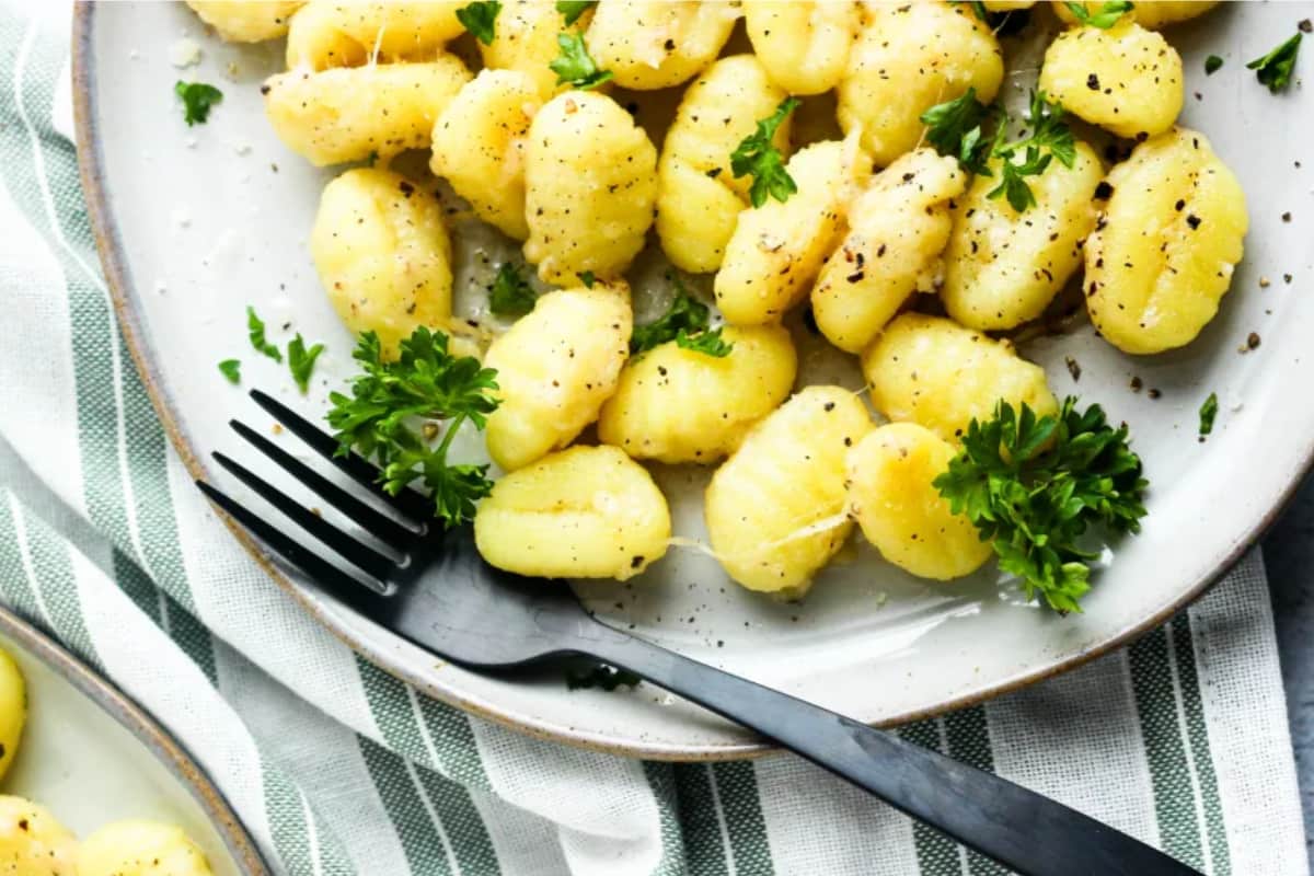 A plate of Cheesy Garlic Buttered Gnocchi.