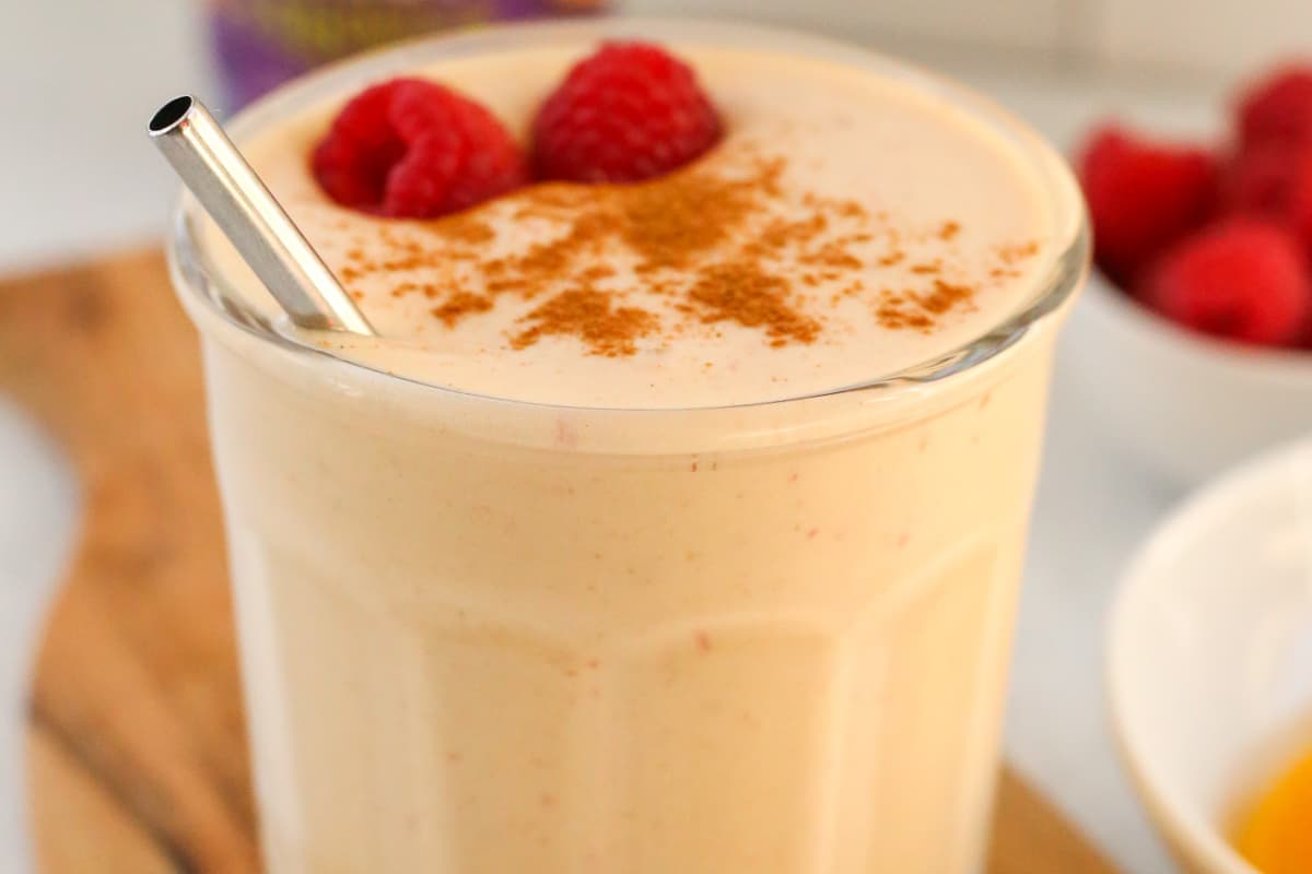 A glass of High Protein Peaches and Cream Smoothie.
