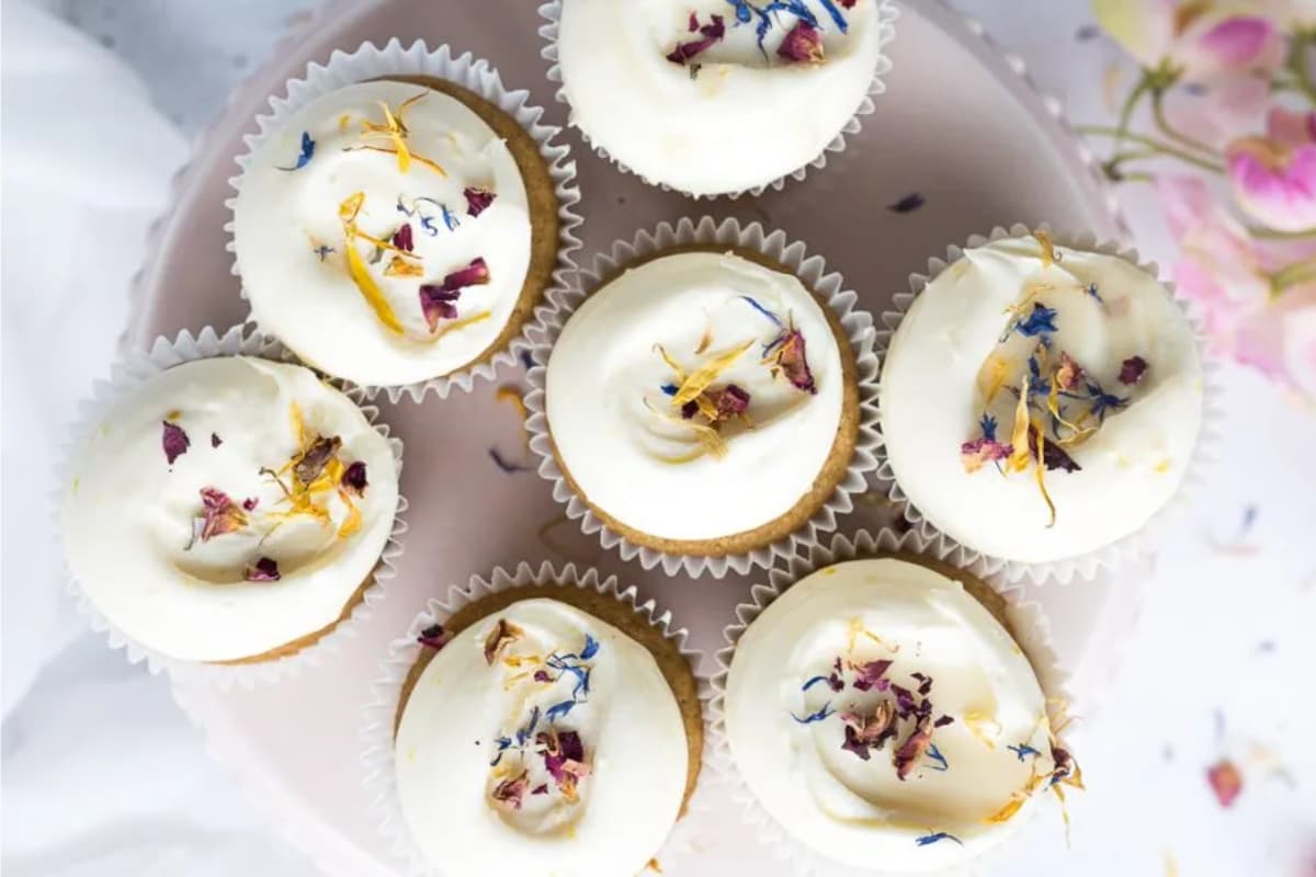 A plate of Honey Lemon Cupcakes with Cream Cheese Frosting.