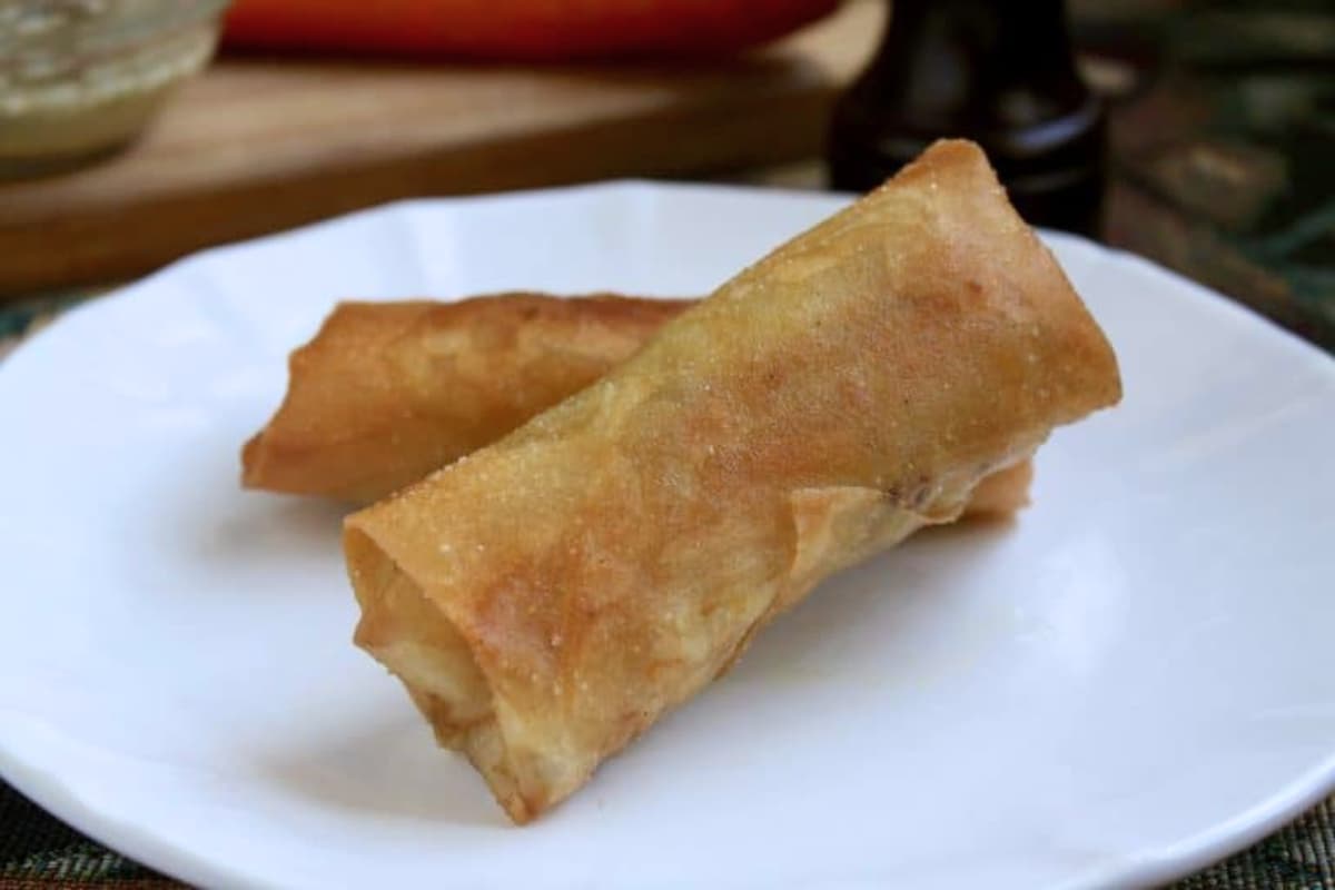 A plate of Filipino Lumpia with Garlic Vinegar Sauce.