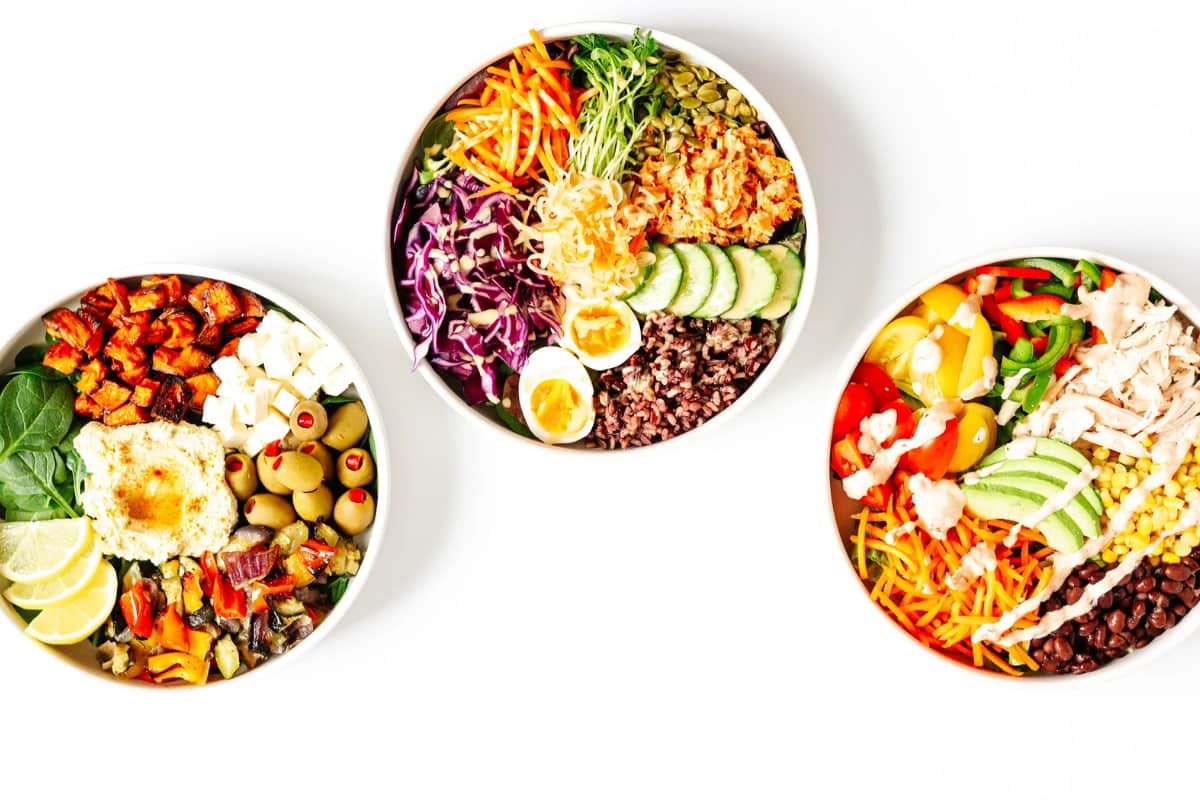 Build Your Own Healthy Nourish Bowls on a counter.