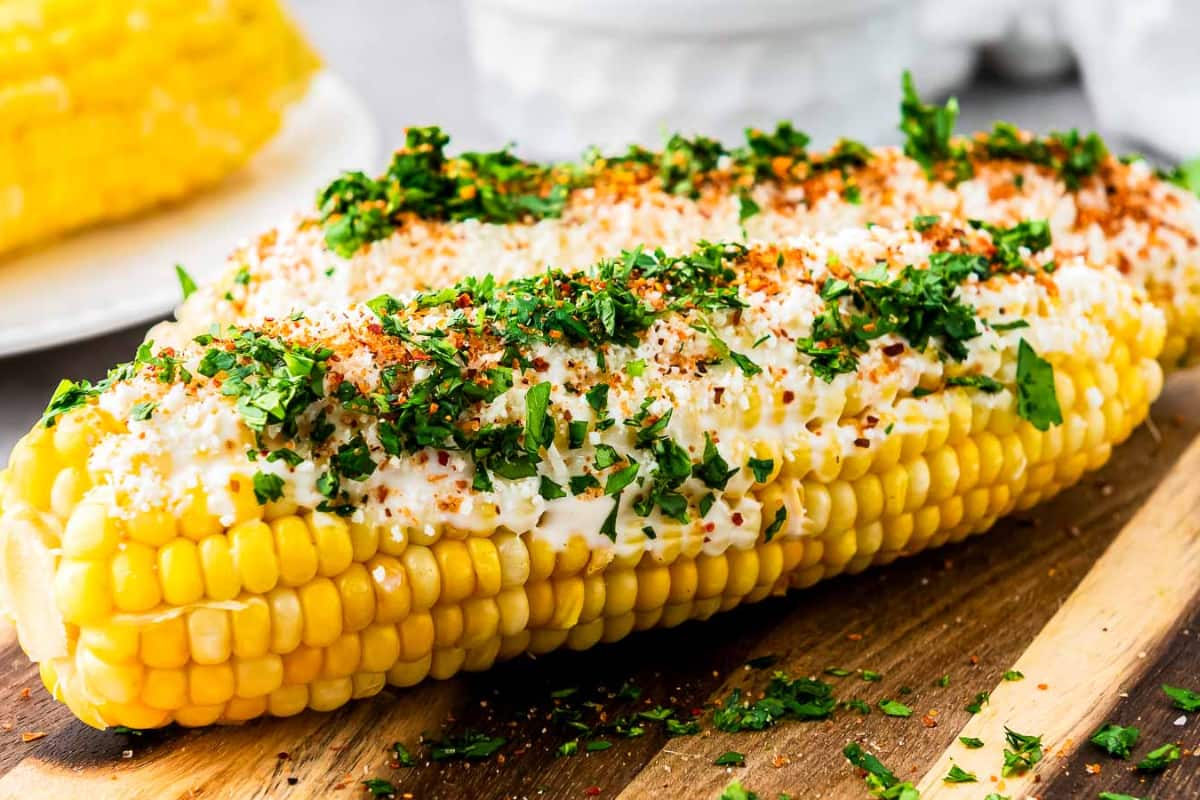 A plate of Mexican Elotes (Street Corn).