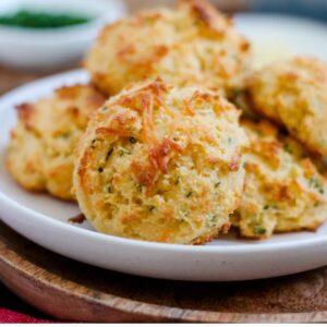 A plate of parmesan chive almond flour biscuits.