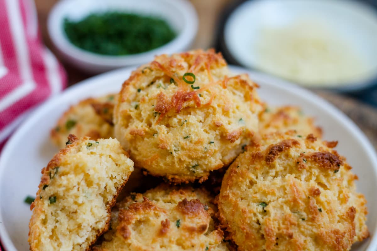 A plate of parmesan chive almond flour biscuits.