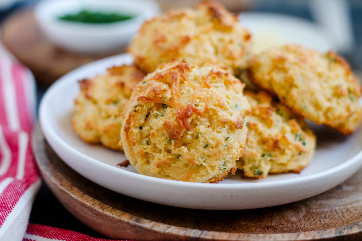 A plate of parmesan chive almond flour biscuits.